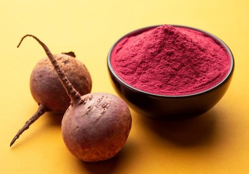 Heap of Beetroot or Beet Root powder with raw whole contains the essential minerals iron, potassium, and magnesium